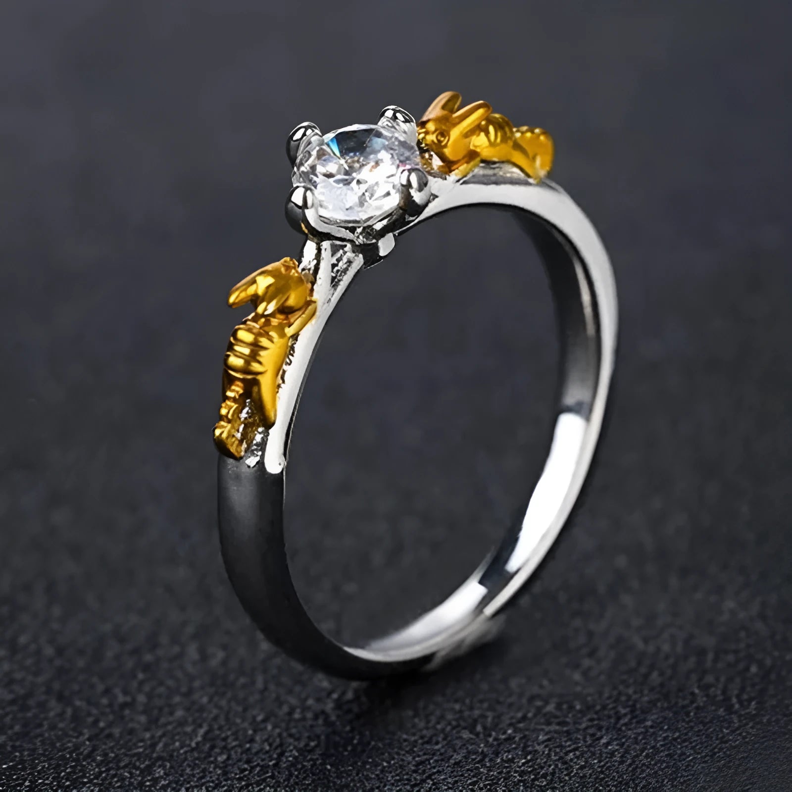 Black gold crystal crown ring on a finger, showing copper metal and decorative stones.