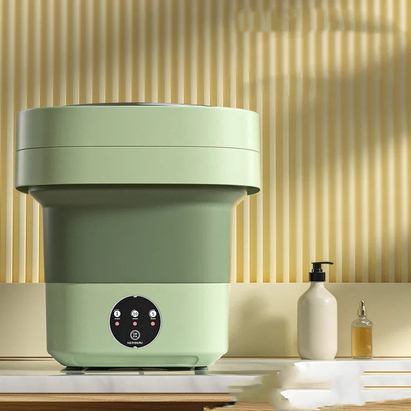 Portable folding washing machine in pine green colour with drain hose and basket