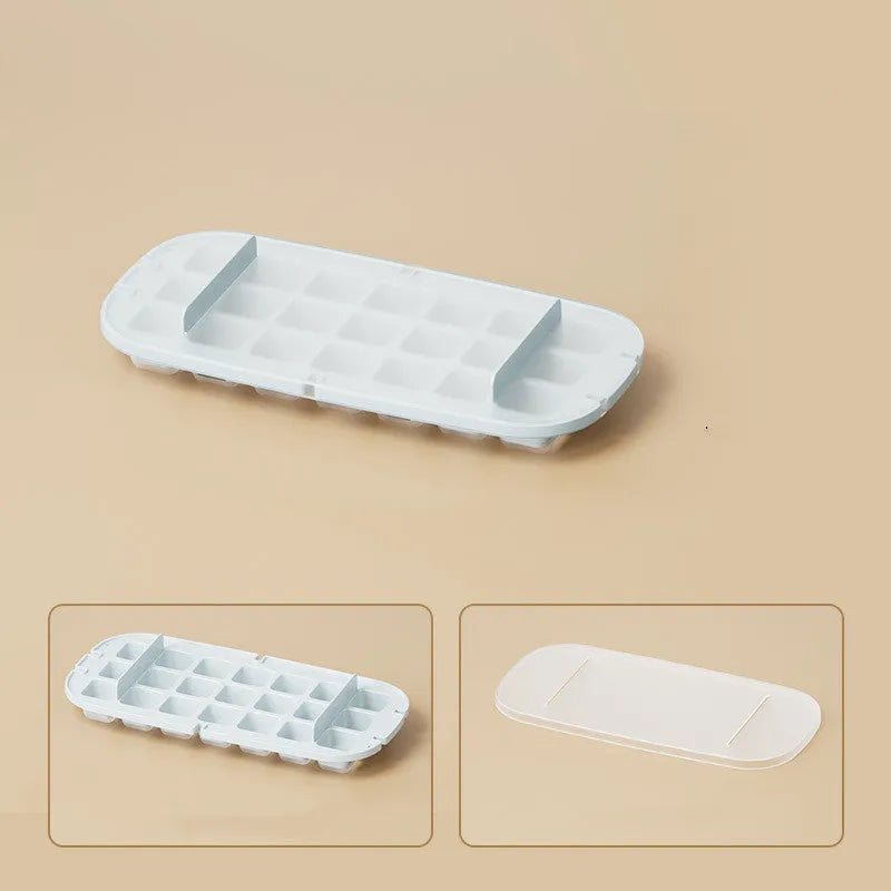 Food grade high-capacity ice cube tray with leverage handle and ice shovel in storage slot, shown in blue colour.