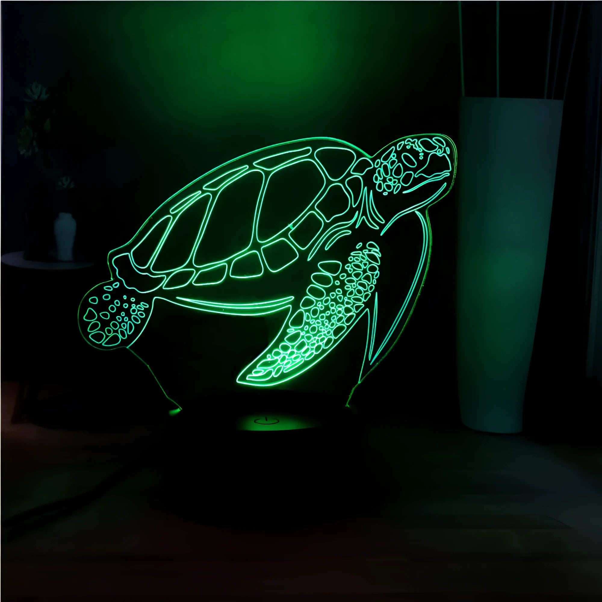 A glowing 3D acrylic turtle-shaped LED night light on a surface, showing its detailed sculpture and soft coloured light.