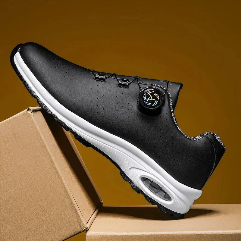 Low-top black and white mesh tennis shoes with cross-strap design and flat composite sole