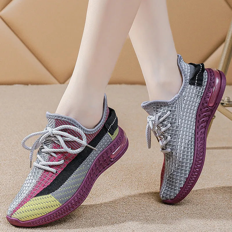 Women's lightweight casual running shoes in purple, black and orange colours with front lace-up design