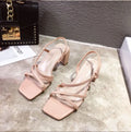 Women's apricot coloured thick heel sandals with backless Roman style design and side cut-outs.