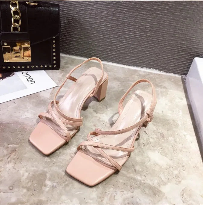 Women's apricot coloured thick heel sandals with backless Roman style design and side cut-outs.