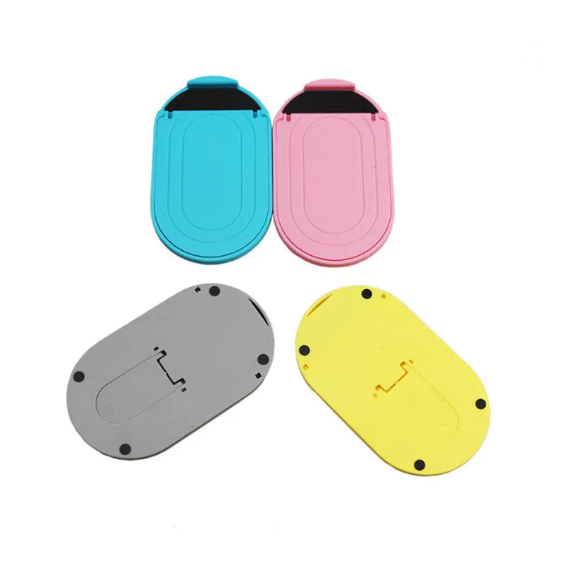 Adjustable plastic lazy bracket mobile phone stand in six colour options on desk