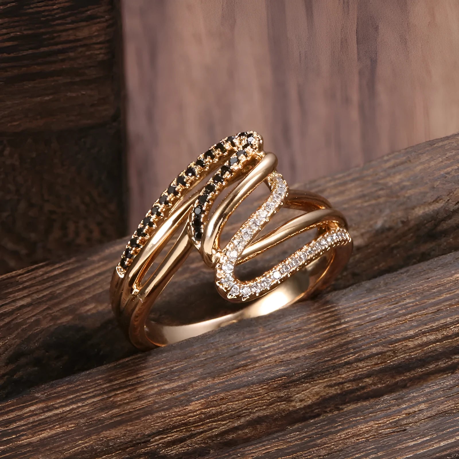 Close-up of a women's copper ring with micro-inlaid zircon stones and a silver-toned electroplated finish.