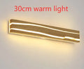 Solid wood rubberwood LED wall light in log colour with acrylic diffuser