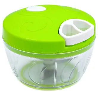 Green manual kitchen chopper with lid, showing stainless steel blades inside, on a countertop.