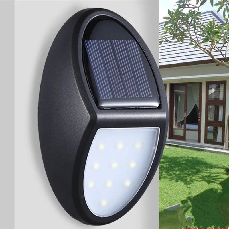 Black LED solar wall light with solar panel showing 75mm x 120mm dimensions