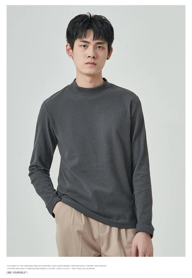 Men's solid colour Dralon half-high collar long sleeve t-shirt on a hanger.
