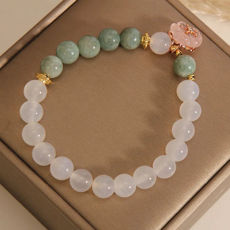 White agate and jade flower bracelet with pink accents on adjustable band
