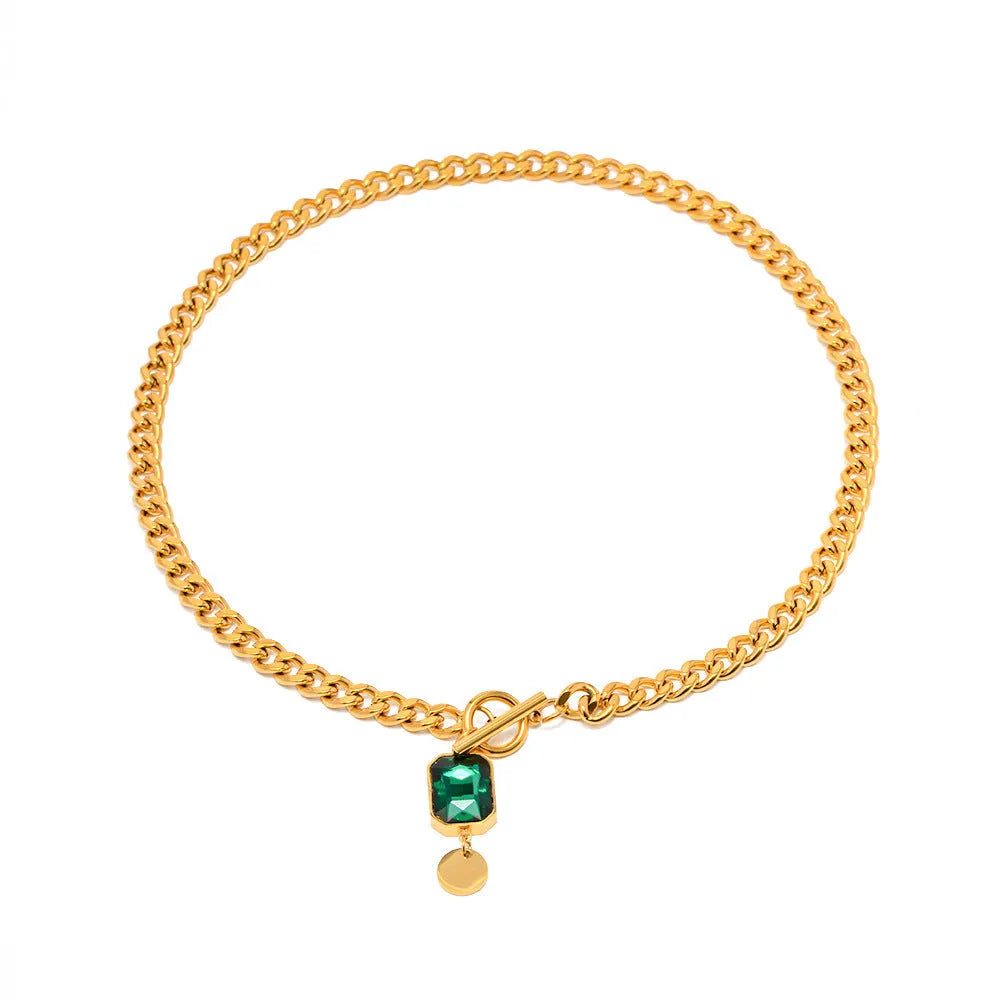 Gold electroplated titanium steel pendant necklace with emerald zircon stone in geometric round shape