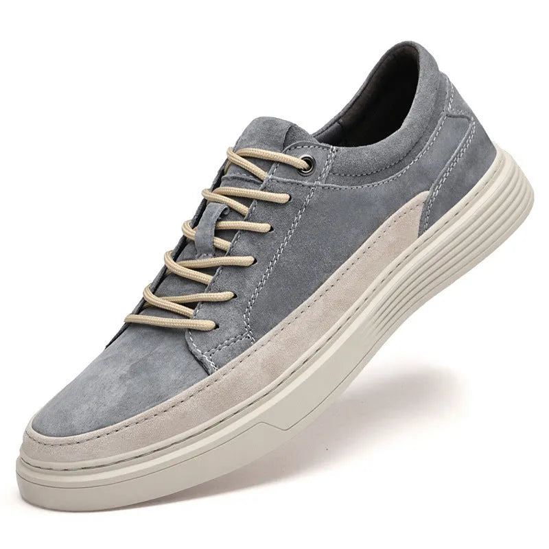 Men's grey pigskin leather low-top casual skate shoes with a round toe and rubber sole on a white background.