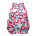 Large blue school backpack with air pillow belt straps on a grey background.