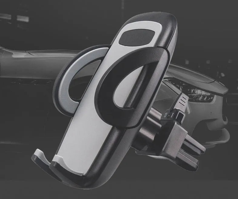 Black plastic mobile phone holder mounted on car air conditioning vent with phone in cradle