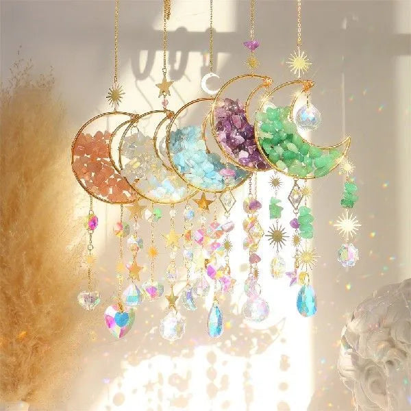 Car interior hanging pendant with large round crystal moon charm on a metal chain.
