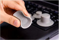 Grey durable plastic laptop cooling pads, two large and two small, on a table.