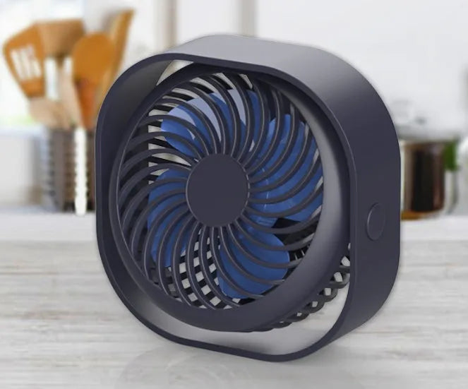 Blue USB desk fan with 360-degree rotation and rotary switch on a desk.