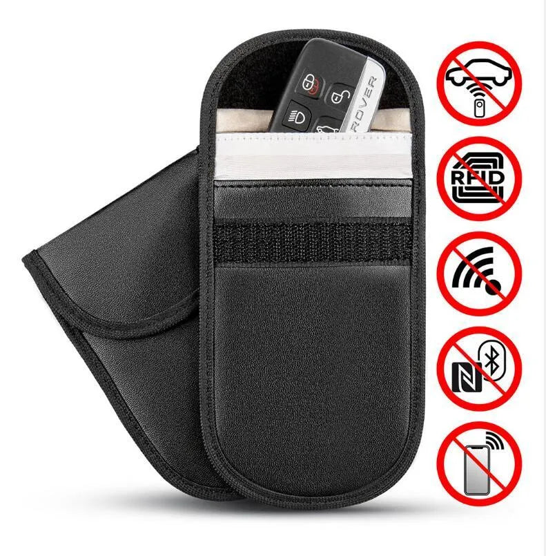 Black microfiber Faraday pouch for blocking car key and credit card signals, shown with a key fob inside.