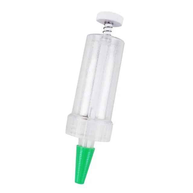 A 12cm long, 3cm diameter plastic mini garden seeder tool for dispensing seeds into pots.