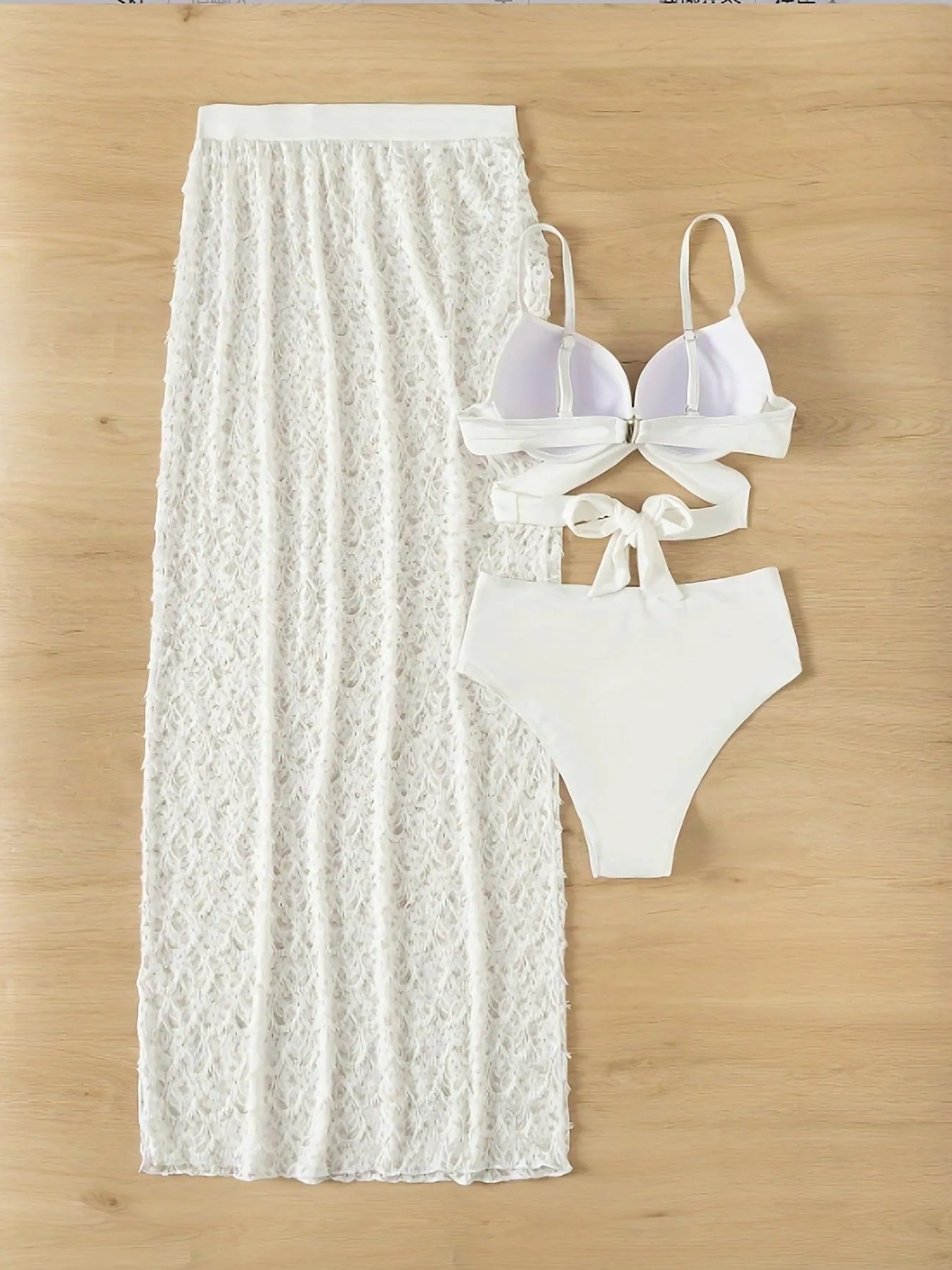 White three-piece nylon swimsuit set with a gathered long skirt, shown on a model for swimming.