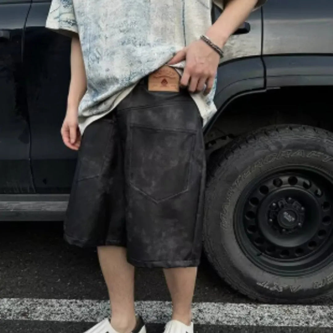 Dirty print pattern on a solid colour loose fit Korean style short sleeve t-shirt.