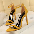 Women's open toe high heel sandals with an ankle buckle strap in a solid colour.