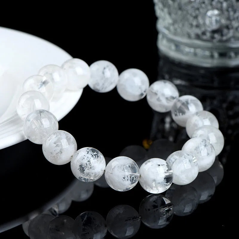 Women's crystal bracelet with blizzard snowflake round beads and Ruyi design in geometric shape.