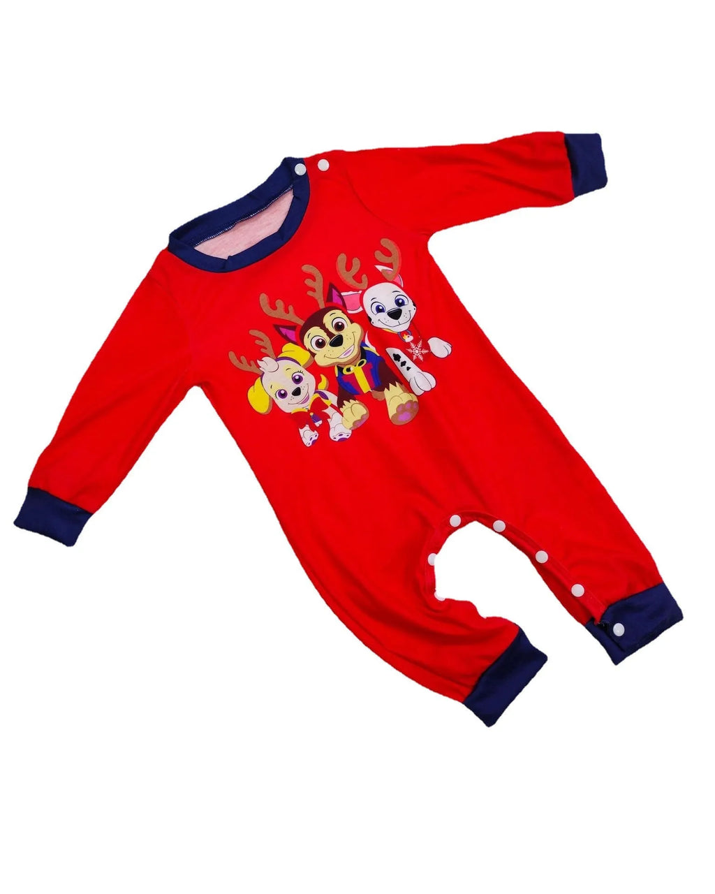 Family wearing matching red plaid Christmas pyjamas with deer print, including adults, children, and a dog.