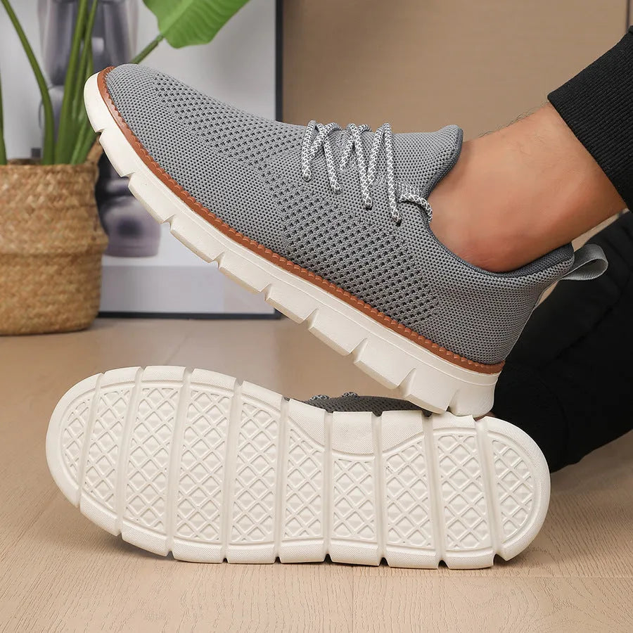 Men's casual sneaker with mesh upper in black or grey colour with round toe design