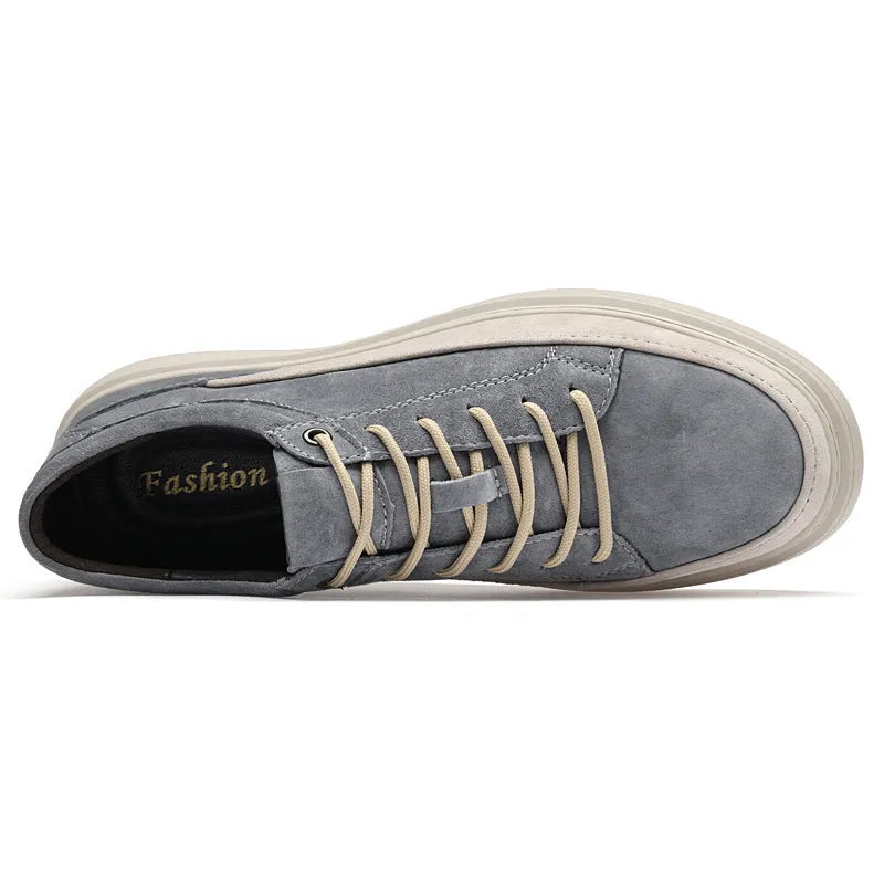Men's grey pigskin leather low-top casual skate shoes with a round toe and rubber sole on a white background.