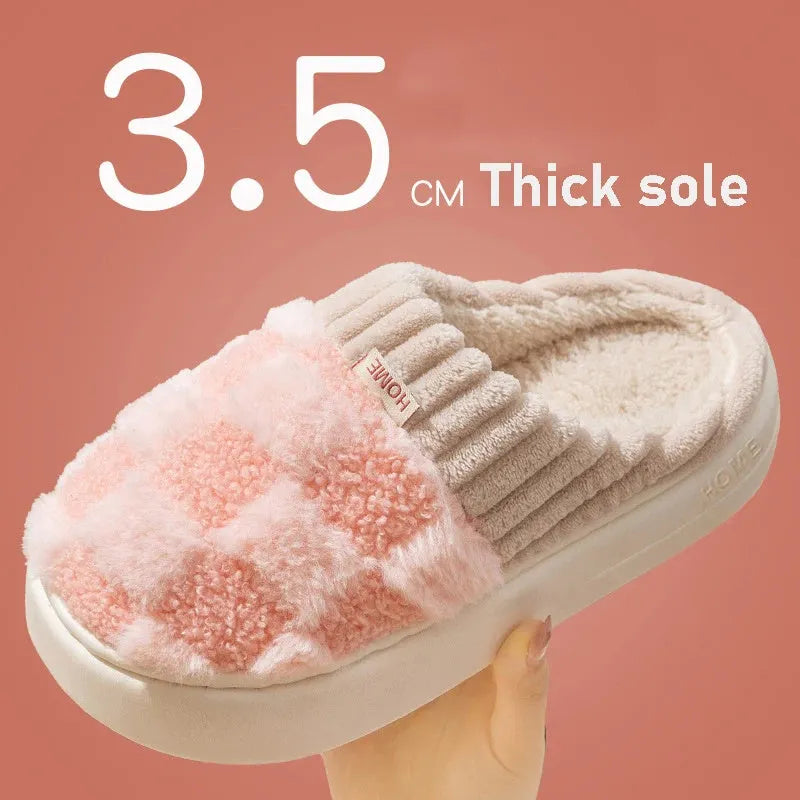 Plaid pattern women's slippers with plush lining and a light-coloured non-slip PVC sole, shown in a grey colour option.