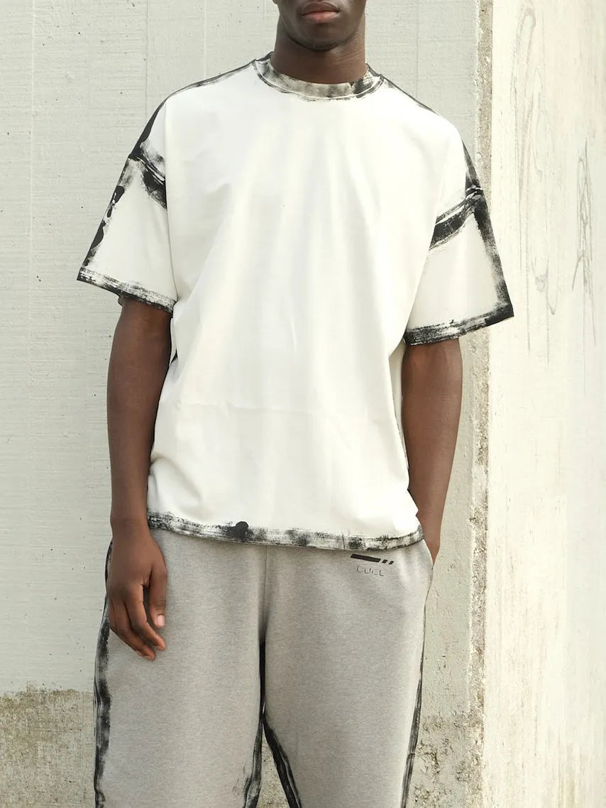 White casual short sleeve top with draped design and printed elements