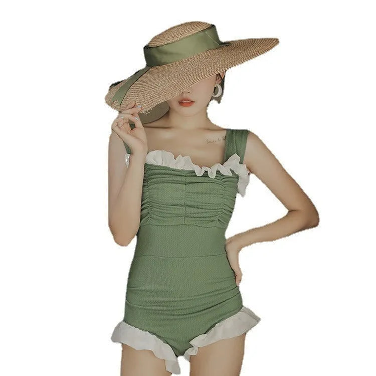 High-waist one-piece swimsuit in Korean style with slimming design available in black, pink, or green colours