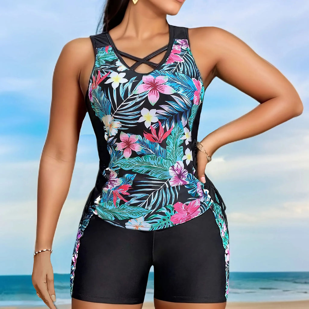 Women's plus size floral print high-waist swimsuit bikini in blue on a mannequin.