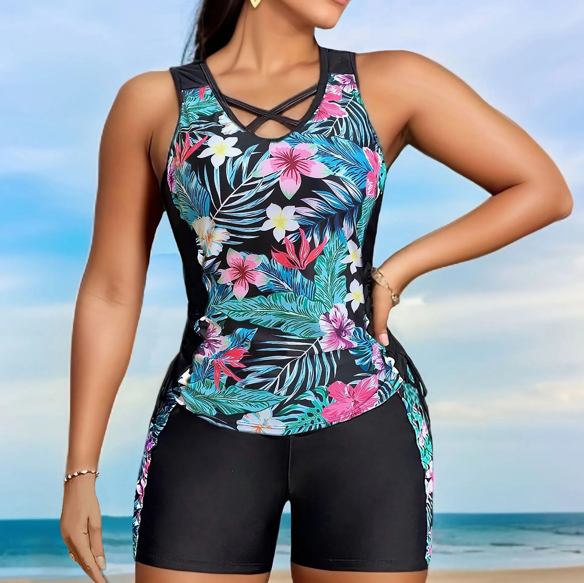 Women's plus size floral print high-waist swimsuit bikini in blue on a mannequin.