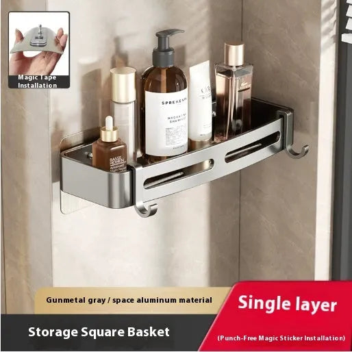 Gun grey metal fan-shaped corner bathroom shelf mounted punch-free on a wall, holding bathroom toiletries.