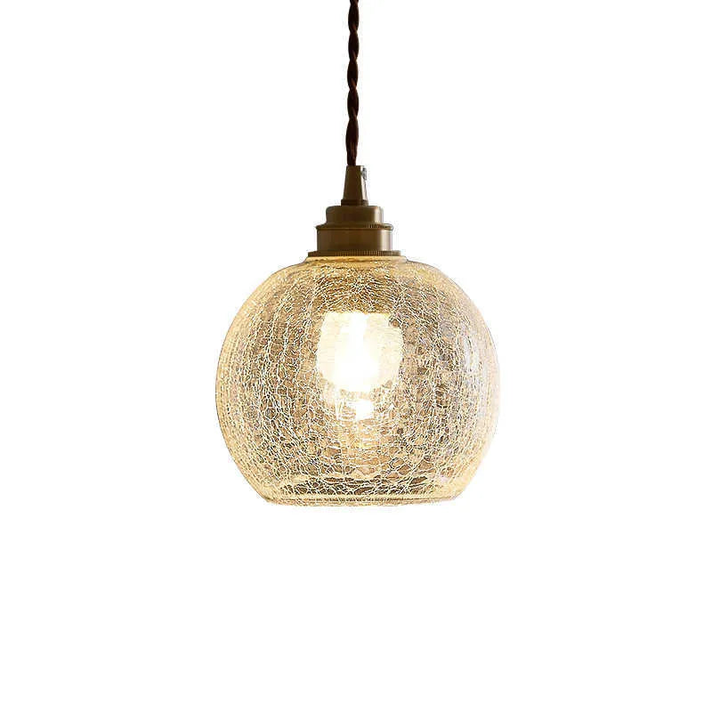 Brass and glass ball chandelier with spherical shade and metallic body