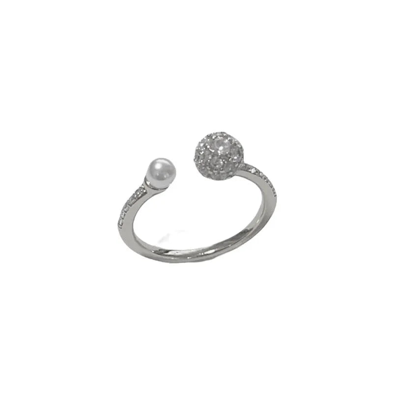 Open-end pearl ring with round zircon stone in gold or silver with geometric shape