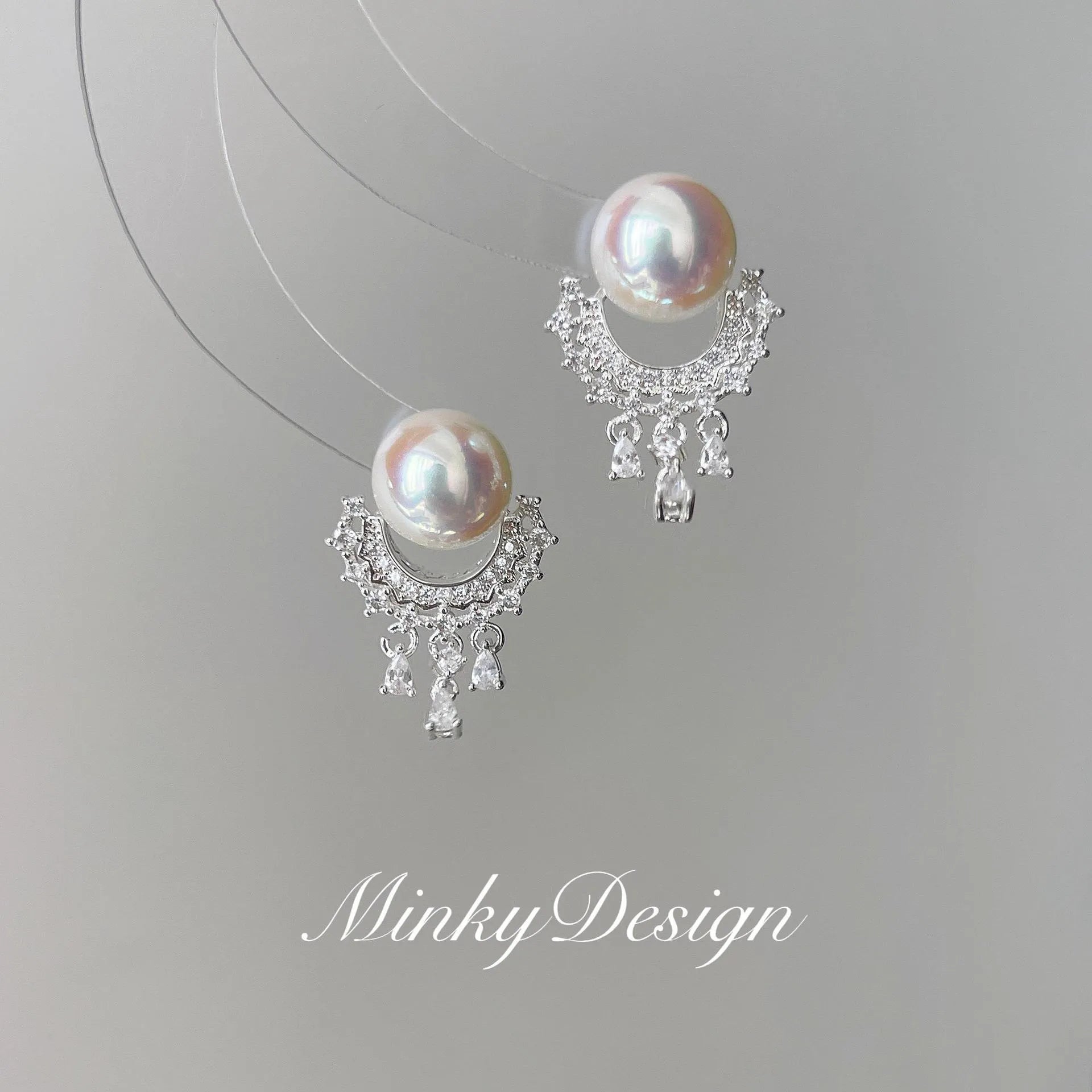 Artificial crystal water drop tassel earrings with round geometric shape and mosquito coil ear clip