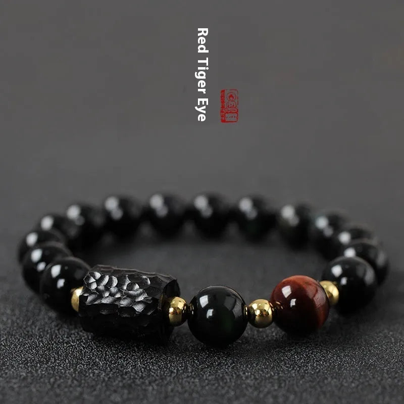 Handmade obsidian bracelet with red and yellow tiger eye beads in circle design
