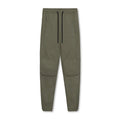 Men's loose grey running pants with ankle ties, laid flat to show mid-waist and full-length design.