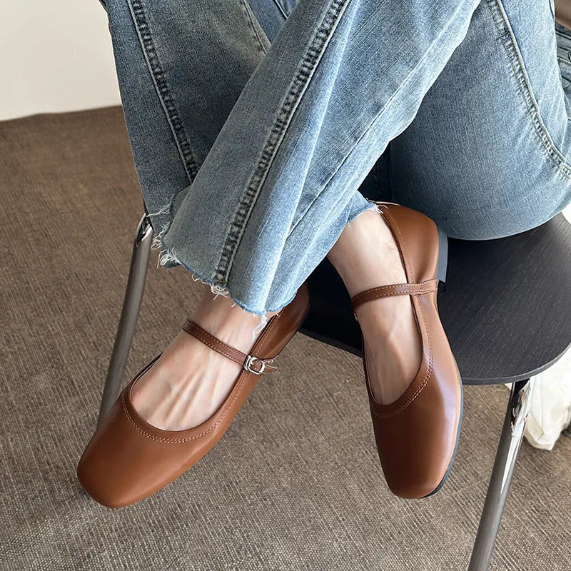 Women's retro brown sheepskin Mary Jane flat pumps with round toe and rubber sole.