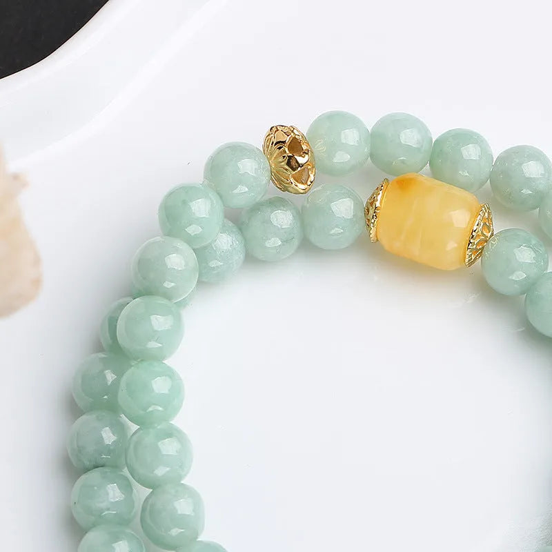 Double-layer women's bracelet with jade round beads and hanging beeswax barrel beads in retro geometry design