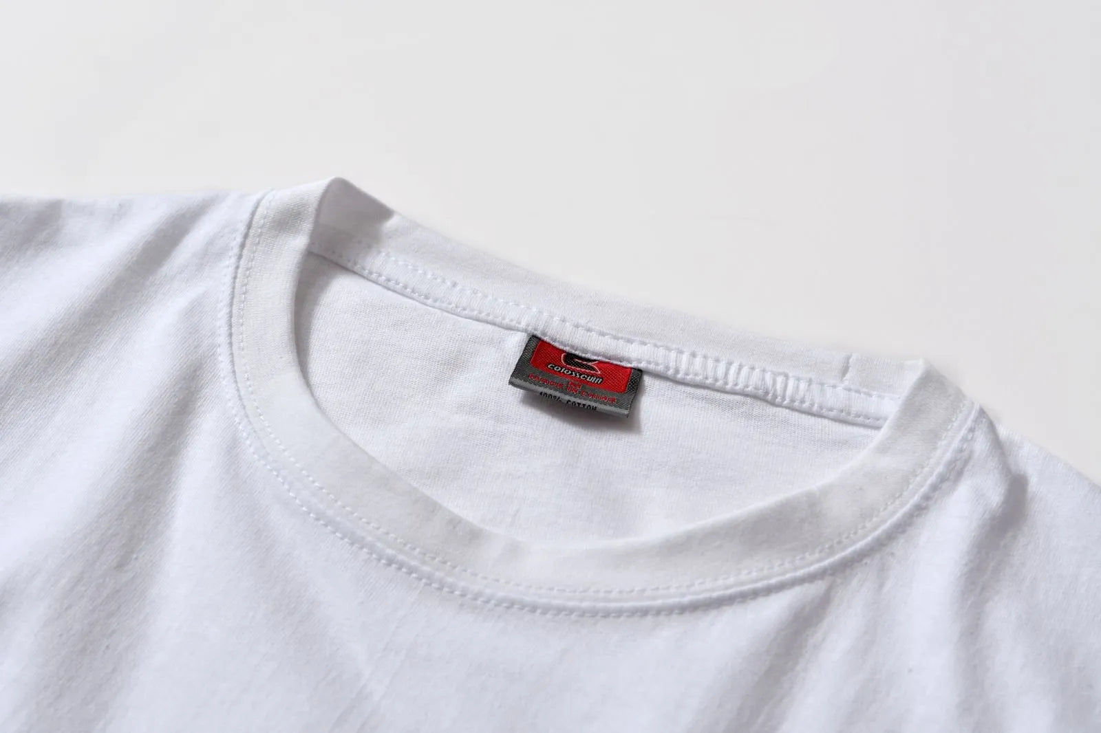 White cotton overalls with round neck and short sleeves in loose pullover style