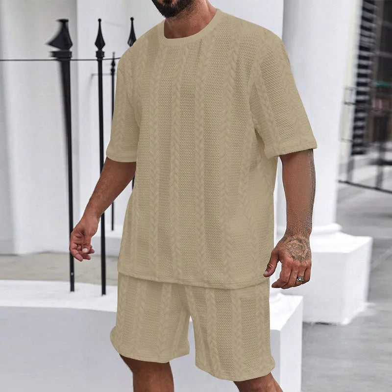 Knitted short sleeve pullover and matching shorts set in a solid colour with jacquard pattern.
