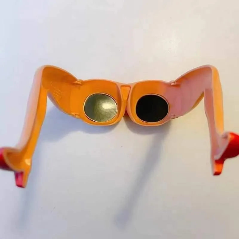 Orange plastic sunglasses with a unique leg and hip personality design.