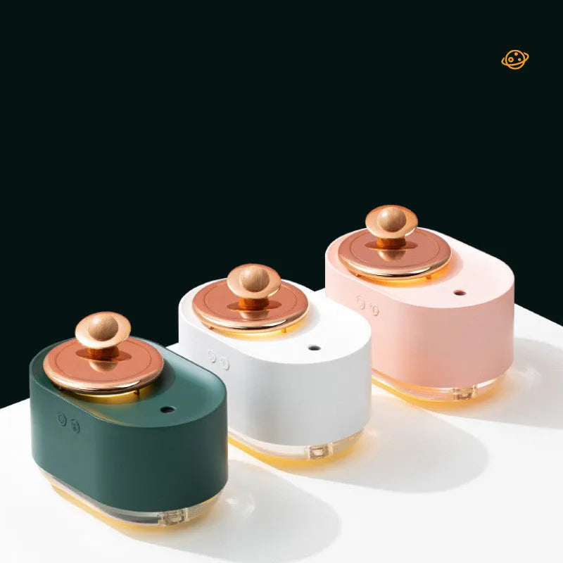 Rotating planet-shaped USB humidifier with night light in green, pink, or white colours.