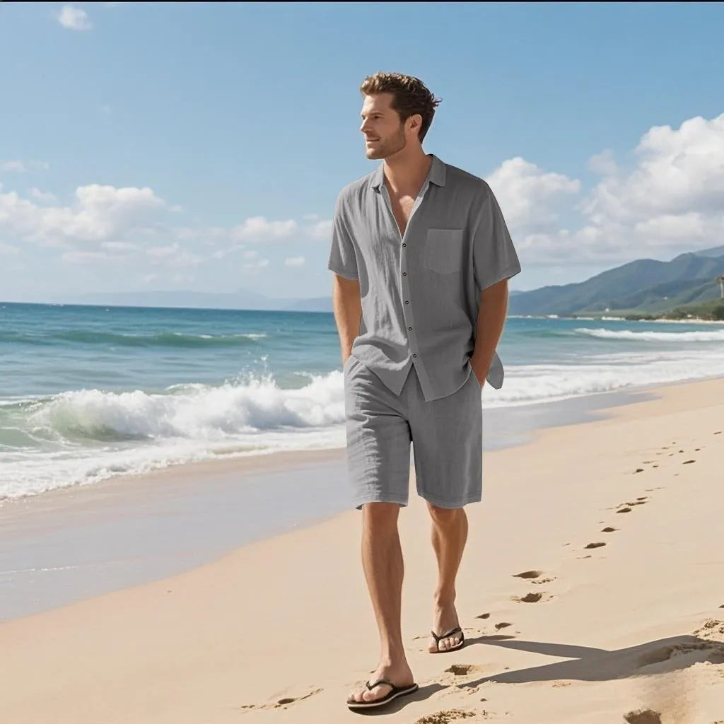 Man wearing a light blue linen blend short sleeve shirt and matching shorts casual set.