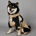 Khaki coloured polyester shell jacket for a dog on a size chart showing S, M, L, XL, 2XL, 3XL, 4XL, and 5XL.
